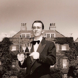 Image of a butler holding a tray of drinks