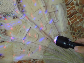 Photo of torch shining onto patterns